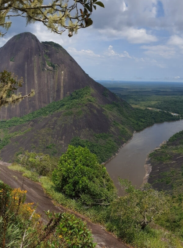 Rock formation and river landscape in Guainía, Colombia surrounded by remote Amazon rainforest