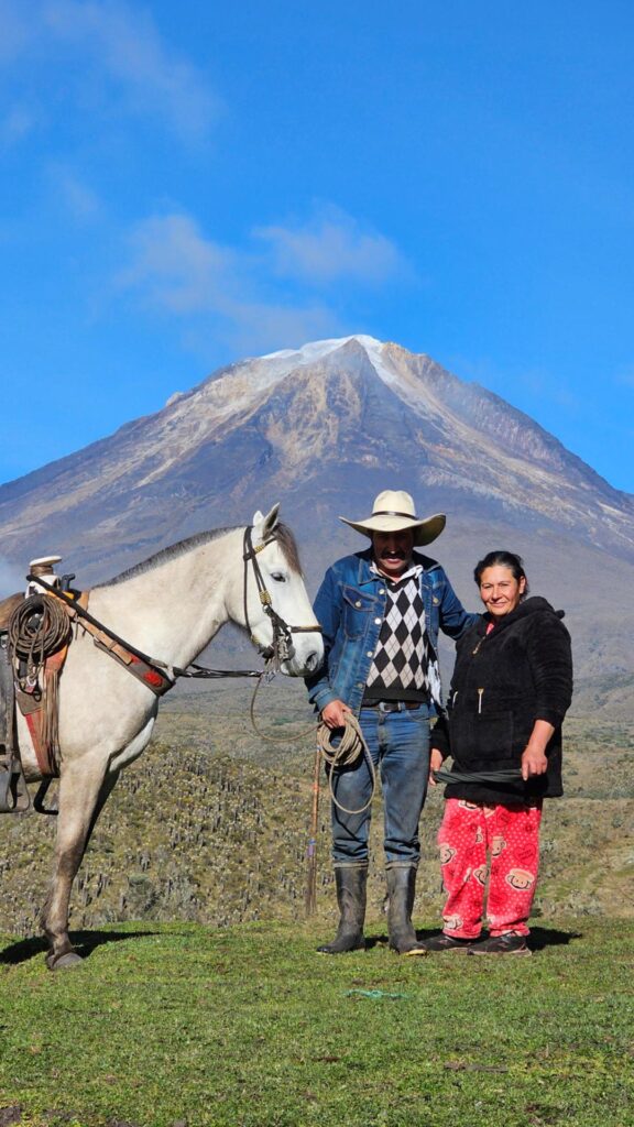 Local arrieros with horses and farmhouse hosts in the Colombian Andes on the Nevado del Tolima route.