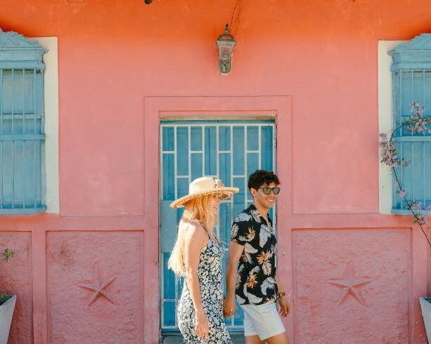 Travelers exploring colorful colonial streets during a cultural city tour in Colombia