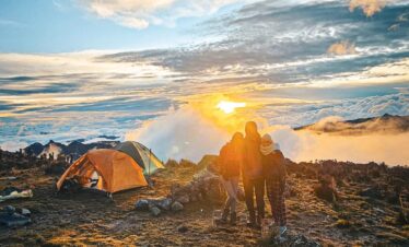 Hikers at sunset campsite in páramo near Nevado del Tolima Colombia Andes