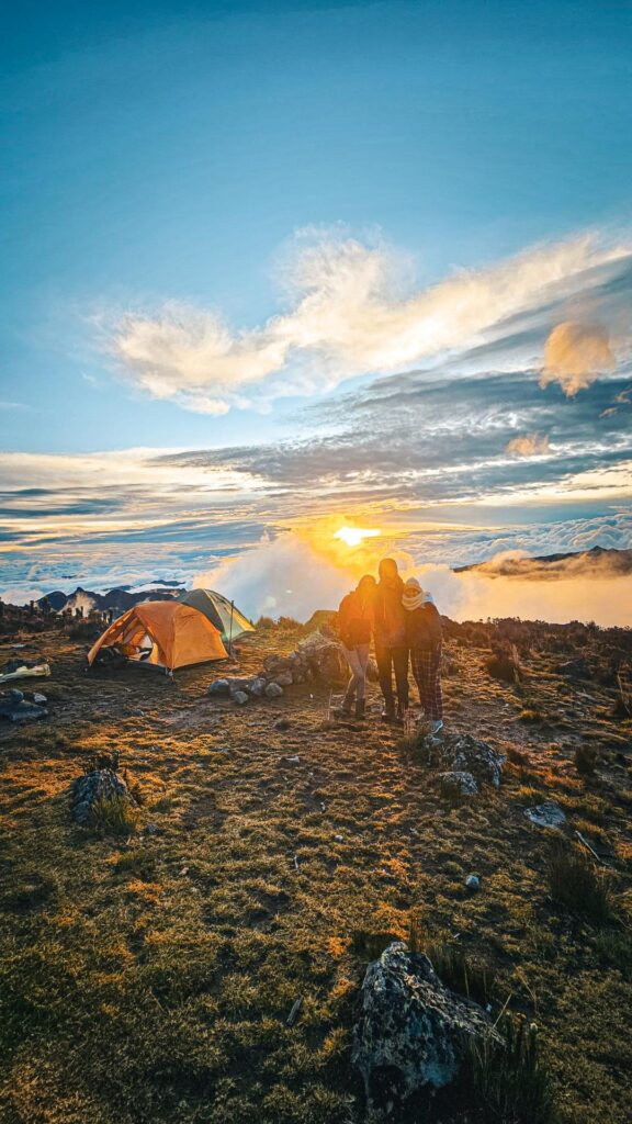 Hikers at sunset campsite in páramo near Nevado del Tolima Colombia Andes