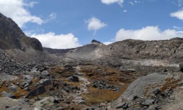 Rocky valley exposed by the retreat of Conejeras Glacier on Nevado Santa Isabel, Colombia.