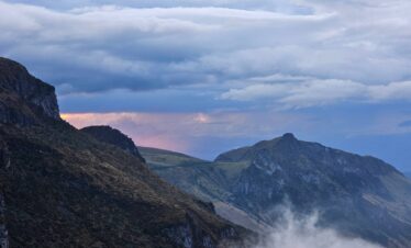 Mountain ridges and cloud-filled valleys in Los Nevados National Natural Park during a high-altitude trekking expedition in Colombia.
